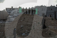 Hamas' Al-Qassam Brigades show of force during handover of hostage bodies