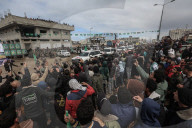 Heavily armed Hamas fighters attend handover of Israeli hostages