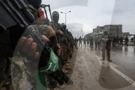 Heavily armed Hamas fighters attend handover of Israeli hostages