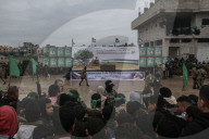 Heavily armed Hamas fighters attend handover of Israeli hostages
