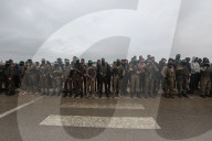 Heavily armed Hamas fighters attend handover of Israeli hostages