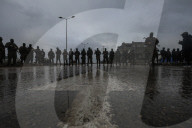 Heavily armed Hamas fighters attend handover of Israeli hostages