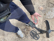 Beachcombing with metal detector on Athens beaches