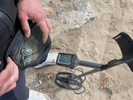 Beachcombing with metal detector on Athens beaches