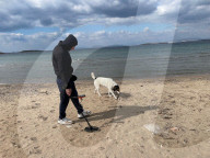 Beachcombing with metal detector on Athens beaches