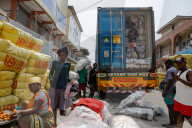 'Dead white person's clothes' mount up as Ghana's Kantamanto market struggles to rebuild after fire.
