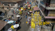 'Dead white person's clothes' mount up as Ghana's Kantamanto market struggles to rebuild after fire.