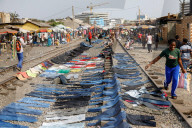 'Dead white person's clothes' mount up as Ghana's Kantamanto market struggles to rebuild after fire.