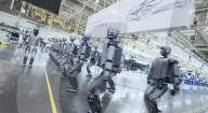 Humanoid robots show off teamwork in car plant takeover