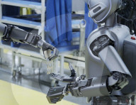 Humanoid robots show off teamwork in car plant takeover