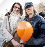 Orange balloons are released over Trafalgar Square in memory & honour of the Bibas family, London, UK.
