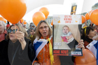 Orange balloons are released over Trafalgar Square in memory & honour of the Bibas family, London, UK.