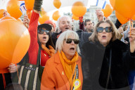 Orange balloons are released over Trafalgar Square in memory & honour of the Bibas family, London, UK.