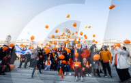 Orange balloons are released over Trafalgar Square in memory & honour of the Bibas family, London, UK.