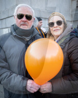 Orange balloons are released over Trafalgar Square in memory & honour of the Bibas family, London, UK.