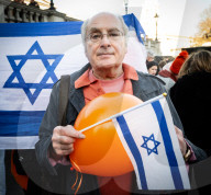 Orange balloons are released over Trafalgar Square in memory & honour of the Bibas family, London, UK.