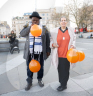 Orange balloons are released over Trafalgar Square in memory & honour of the Bibas family, London, UK.