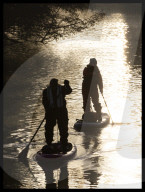 Paddle boarders at  sunrise