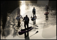 Paddle boarders at  sunrise