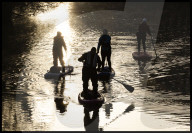 Paddle boarders at  sunrise
