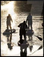 Paddle boarders at  sunrise