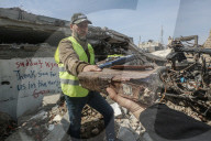 Gaza rescue team recovers manuscripts and antiquities from rubble