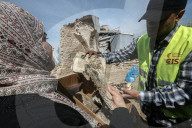 Gaza rescue team recovers manuscripts and antiquities from rubble