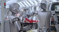 Robots deliver women's day roses to car plant workers