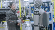 Robots deliver women's day roses to car plant workers