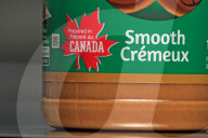 Consumer Grocery Products With Various Labels Showing Country Of Origin.