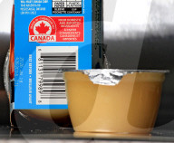 Consumer Grocery Products With Various Labels Showing Country Of Origin.