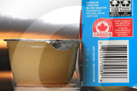 Consumer Grocery Products With Various Labels Showing Country Of Origin.