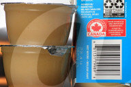 Consumer Grocery Products With Various Labels Showing Country Of Origin.