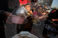 Palestinian Children Receive Iftar Meal at Gaza City Distribution Point During Ramadan