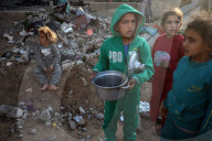 Palestinian Children Receive Iftar Meal at Gaza City Distribution Point During Ramadan