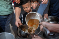 Palestinian Children Receive Iftar Meal at Gaza City Distribution Point During Ramadan