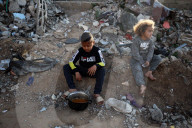 Palestinian Children Receive Iftar Meal at Gaza City Distribution Point During Ramadan