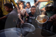 Palestinian Children Receive Iftar Meal at Gaza City Distribution Point During Ramadan