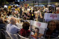 Hostage families hold Shabbat dinner facing army headquarters