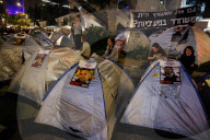 Hostage families hold Shabbat dinner facing army headquarters