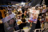 Hostage families hold Shabbat dinner facing army headquarters