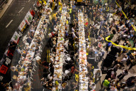 Hostage families hold Shabbat dinner facing army headquarters