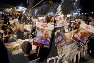 Hostage families hold Shabbat dinner facing army headquarters