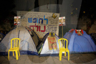 Hostage families hold Shabbat dinner facing army headquarters