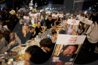 Hostage families hold Shabbat dinner facing army headquarters