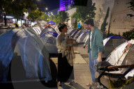Hostage families hold Shabbat dinner facing army headquarters