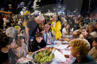 Hostage families hold Shabbat dinner facing army headquarters