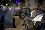 Hostage families hold Shabbat dinner facing army headquarters