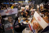 Hostage families hold Shabbat dinner facing army headquarters