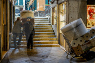 Senior Workers Transporting Goods In Venice